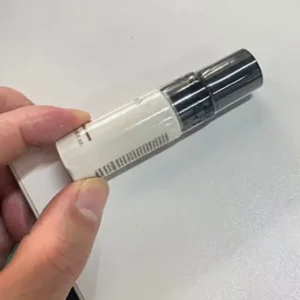 Final shrink sleeve labeling result on the perfume bottle